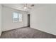 Carpeted bedroom with neutral walls, a ceiling fan and a window at 800 Fetter Ct, Henderson, NV 89052