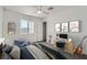 Staged bedroom featuring a bed, desk, and decor under a ceiling fan at 800 Fetter Ct, Henderson, NV 89052