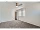 Carpeted bedroom with neutral walls, a ceiling fan and a window at 800 Fetter Ct, Henderson, NV 89052
