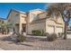 Charming two-story home featuring a two-car garage and low maintenance desert landscaping at 800 Fetter Ct, Henderson, NV 89052