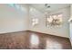 Bright living room with wood floors, modern lighting, and large windows providing ample natural light at 800 Fetter Ct, Henderson, NV 89052