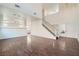 Large living room featuring hardwood floors, a staircase, and a view to other parts of the house at 800 Fetter Ct, Henderson, NV 89052