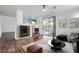 Elegant living room with a modern fireplace, wine cooler, and sliding doors to outdoor space at 800 Fetter Ct, Henderson, NV 89052