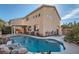 Private pool featuring rock accents and lush landscaping, with a view of the home at 800 Fetter Ct, Henderson, NV 89052