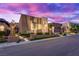 Modern home featuring desert landscaping, stone accents, and lighted walkway enhances its curb appeal at 819 Bolide St, Las Vegas, NV 89138