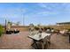 The backyard features a brick patio with various seating arrangements perfect for relaxing or entertaining guests at 8432 Alder Rain St, Las Vegas, NV 89113