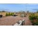 Spacious brick backyard with lounge chairs, patio seating, playhouse, and manicured landscaping at 8432 Alder Rain St, Las Vegas, NV 89113