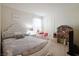 Cozy bedroom with white furniture, including a bed and a desk for studying at 8432 Alder Rain St, Las Vegas, NV 89113