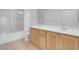 Bright bathroom featuring a double sink vanity and shower with glass door at 8805 Jeffreys St # 2082, Las Vegas, NV 89123