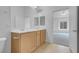 Bright bathroom with double sinks and door leading to the bedroom at 8805 Jeffreys St # 2082, Las Vegas, NV 89123