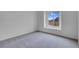 Bedroom featuring neutral carpet, a large window and white walls at 8805 Jeffreys St # 2082, Las Vegas, NV 89123