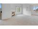 Spacious living room with a cozy fireplace and sliding glass doors leading to outdoor space at 8805 Jeffreys St # 2082, Las Vegas, NV 89123