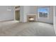 Bright living room features a fireplace and large windows offering ample natural light at 8805 Jeffreys St # 2082, Las Vegas, NV 89123