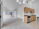 Open-concept living space with kitchen, dining area, and neutral decor at 8805 Jeffreys St # 2082, Las Vegas, NV 89123