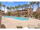 Resort-style pool area with plenty of seating and palm trees at 8805 Jeffreys St # 2082, Las Vegas, NV 89123