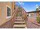Exterior staircase to an upper-level unit with well-maintained surroundings and convenient access at 8805 Jeffreys St # 2082, Las Vegas, NV 89123