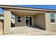 Covered back patio area perfect for outdoor entertaining, features a paved surface and leads into the home at 9067 Mapledale Ranch Ct, Las Vegas, NV 89139