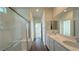 Stylish bathroom features double sinks, glass enclosed shower, and contemporary finishes at 9067 Mapledale Ranch Ct, Las Vegas, NV 89139