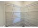 A large pantry equipped with ample metal shelving provides plentiful storage space at 9067 Mapledale Ranch Ct, Las Vegas, NV 89139