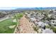 High-angle shot of residential buildings and golf course, underscoring community features and recreational opportunities at 912 Duckhorn Ct # 101, Las Vegas, NV 89144