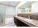 Modern bathroom featuring dual sinks, vanity, and walk-in shower at 912 Duckhorn Ct # 101, Las Vegas, NV 89144