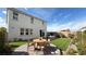 Spacious backyard featuring artificial grass, a patio, and outdoor seating at 9190 Oakdale Ranch Ct, Las Vegas, NV 89139