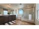 Bright bathroom featuring double sinks, soaking tub, and glass enclosed shower offering natural light and modern fixtures at 9190 Oakdale Ranch Ct, Las Vegas, NV 89139