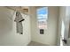Well-lit closet with shelving and a window, providing ample storage and natural light at 9190 Oakdale Ranch Ct, Las Vegas, NV 89139