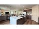 Spacious open kitchen featuring a large island, stainless steel appliances, and seating for three at 9190 Oakdale Ranch Ct, Las Vegas, NV 89139