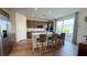 Open kitchen featuring a large island with seating, stainless steel appliances, and sliding glass doors at 9190 Oakdale Ranch Ct, Las Vegas, NV 89139