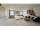 Spacious main bedroom showcasing a neutral color palette, comfortable seating area, and ample natural light at 9190 Oakdale Ranch Ct, Las Vegas, NV 89139
