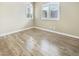 Bright bedroom featuring hardwood floors, neutral paint, and shuttered windows at 1001 Collingtree St, Las Vegas, NV 89145