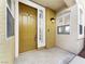 Inviting entryway with a solid front door, sidelight window, and sconce lighting at 1001 Collingtree St, Las Vegas, NV 89145