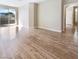 Spacious living area featuring hardwood flooring, light-colored walls, and sliding glass doors at 1001 Collingtree St, Las Vegas, NV 89145