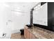 Modern bathroom with wood cabinets, granite countertop and a separate shower and tub at 10227 Sunset Gardens Dr, Las Vegas, NV 89135