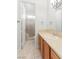 A well-lit bathroom features a vanity, sink, tile flooring, and a glass shower at 10227 Sunset Gardens Dr, Las Vegas, NV 89135