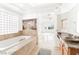 Beautiful primary bathroom with dual sink vanity and soaking tub at 10227 Sunset Gardens Dr, Las Vegas, NV 89135