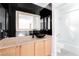 Bathroom featuring wood cabinets, granite countertop and a separate shower and tub at 10227 Sunset Gardens Dr, Las Vegas, NV 89135