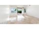 Bright and airy bedroom with tile floors and French doors to backyard and landscape at 10227 Sunset Gardens Dr, Las Vegas, NV 89135
