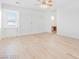 Spacious bedroom with hardwood floors, built-in shelving, and natural light at 10227 Sunset Gardens Dr, Las Vegas, NV 89135