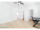 Bright bedroom featuring hardwood floors, a ceiling fan and closet with an open doorway at 10227 Sunset Gardens Dr, Las Vegas, NV 89135