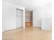 Bedroom featuring built-in shelving, a closet, and laminate flooring at 10227 Sunset Gardens Dr, Las Vegas, NV 89135