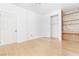 Bedroom featuring built-in shelving, a closet, and laminate flooring at 10227 Sunset Gardens Dr, Las Vegas, NV 89135