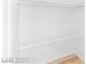 Walk-in closet with white walls, light wood floors, and chrome clothing racks at 10227 Sunset Gardens Dr, Las Vegas, NV 89135