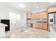 Dining area featuring built-in cabinetry and countertops, with a stainless steel fridge at 10227 Sunset Gardens Dr, Las Vegas, NV 89135