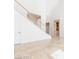 Bright foyer with tile floors and staircase leading to the second floor of home at 10227 Sunset Gardens Dr, Las Vegas, NV 89135