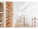 Bright hallway with wood shelving and tiled flooring throughout at 10227 Sunset Gardens Dr, Las Vegas, NV 89135