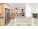A spacious kitchen features stainless steel appliances, granite countertops, and custom cabinetry at 10227 Sunset Gardens Dr, Las Vegas, NV 89135