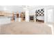 Open concept home with kitchen, living room, fireplace, and a light-filled atmosphere at 10227 Sunset Gardens Dr, Las Vegas, NV 89135