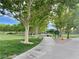A walking trail provides a scenic route through the park, lined with a canopy of trees at 10227 Sunset Gardens Dr, Las Vegas, NV 89135